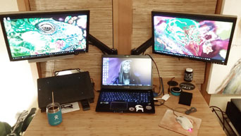 Uplift monitors to ideal viewing levels with a set of monitor arms