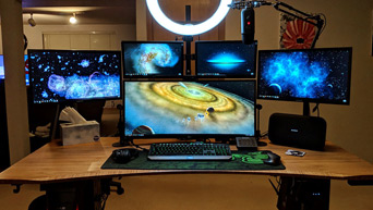 Environmentally friendly bamboo workstation with multiple monitor setup