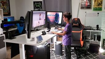 A white UPLIFT V2 Laminate Standing Desk
