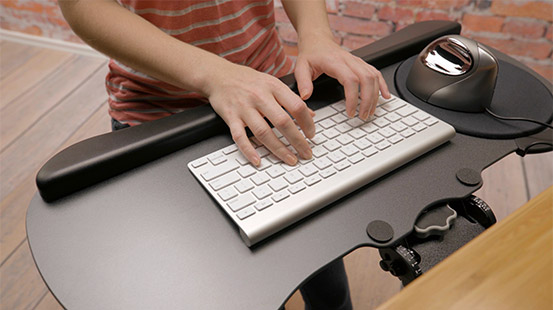 Work better and live healthier with an ergonomic workstation UPLIFT Adjustable Height Standing Desk and Keyboard Tray